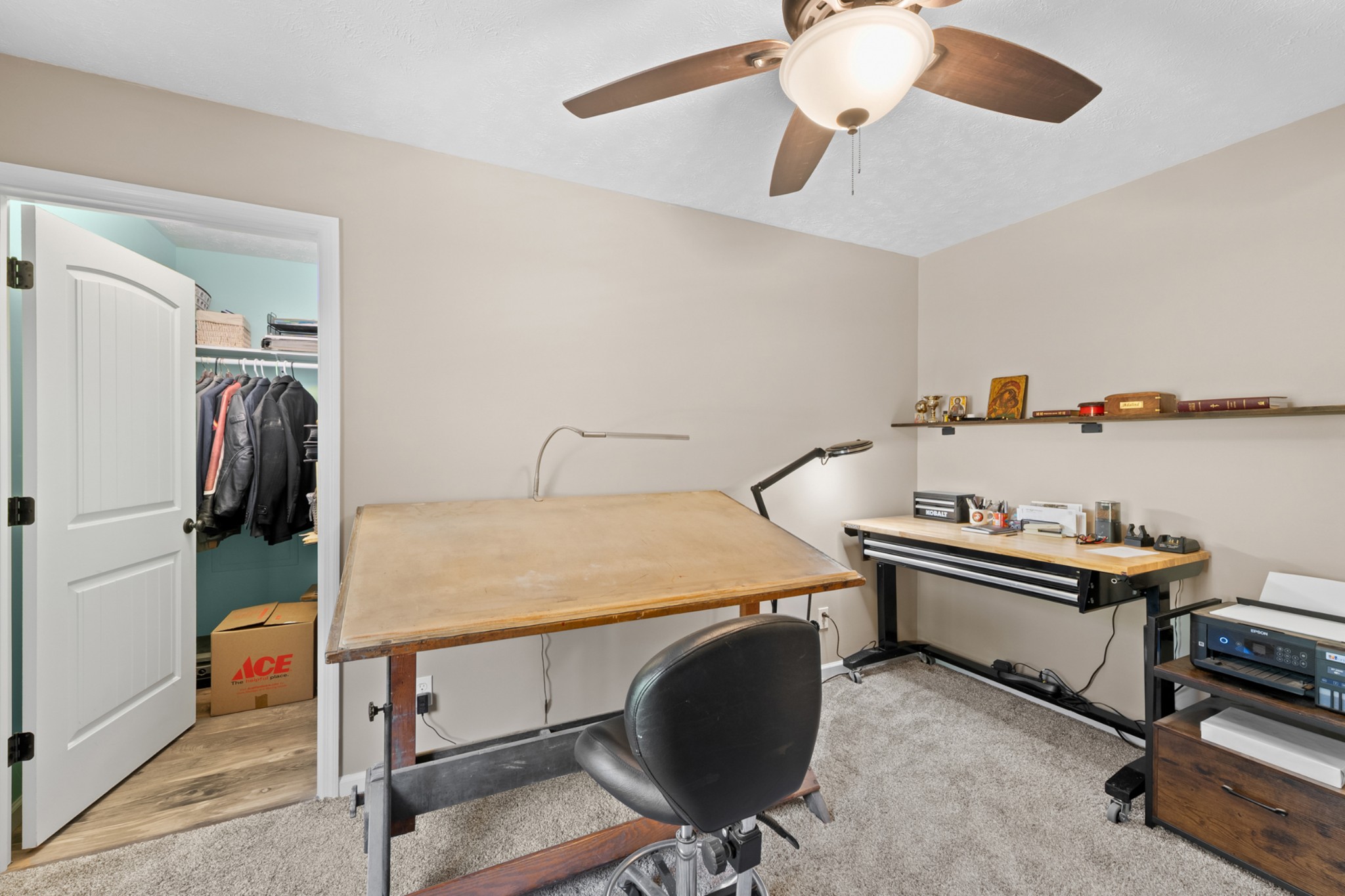 936 Adams Road Tracy City, TN 37387 - Photo 20 of 28 a bedroom with a bed and a chandelier