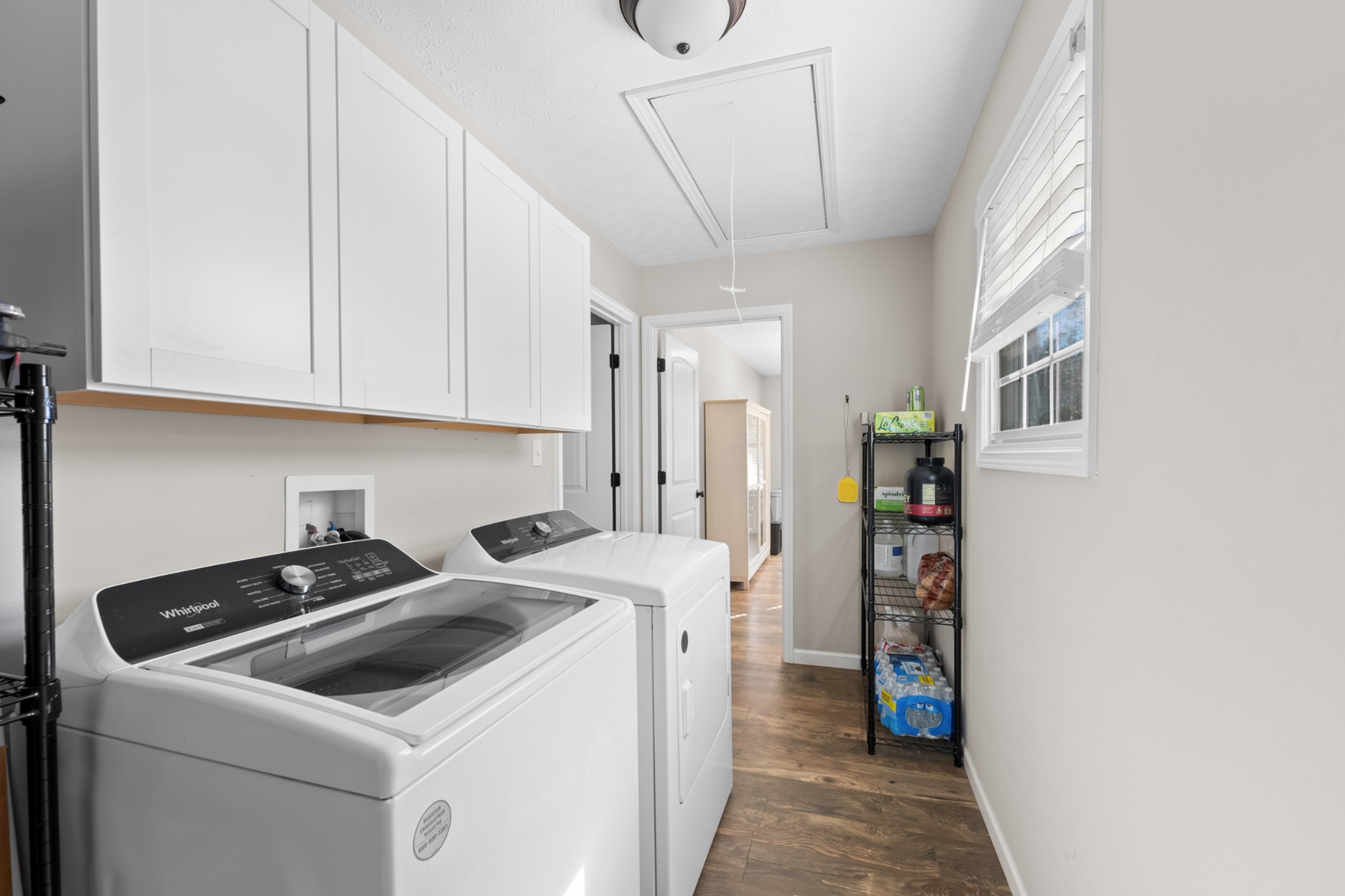 936 Adams Road Tracy City, TN 37387 - Photo 22 of 28 a view of storage and utility room with washer and dryer