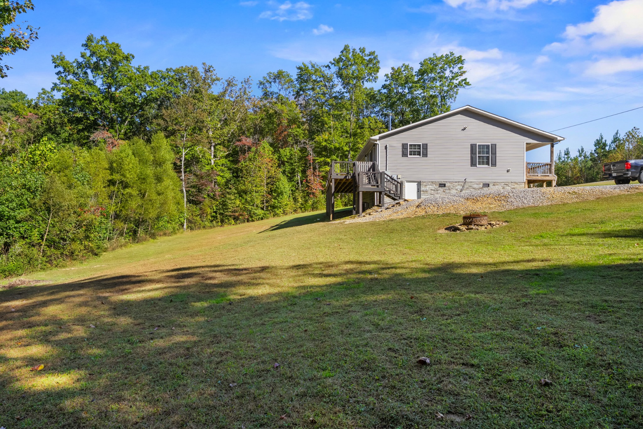 936 Adams Road Tracy City, TN 37387 - Photo 26 of 28 a view of a house with a yard