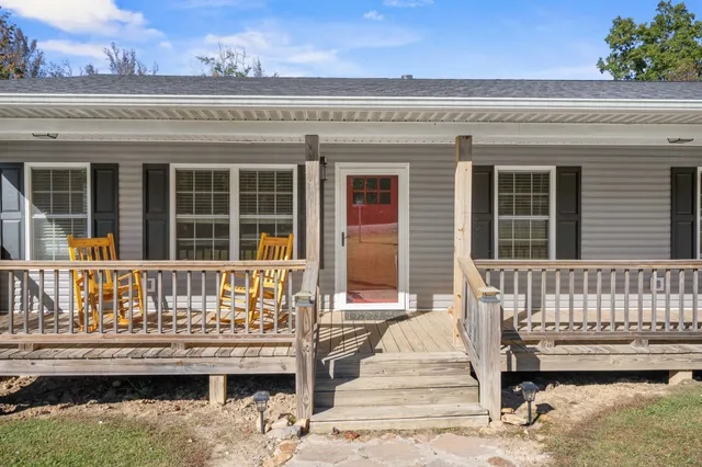 a view of a patio with wooden floor