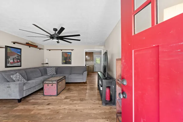 a living room with furniture and a window
