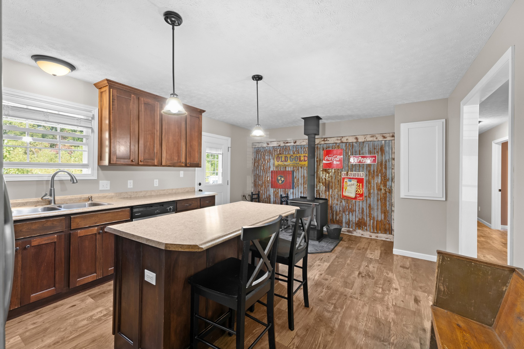 936 Adams Road Tracy City, TN 37387 - Photo 9 of 28 a kitchen that has a table chairs in it and wooden floors