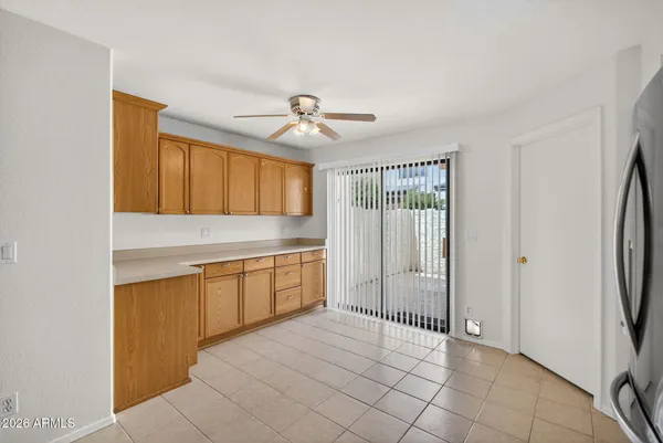 a kitchen with stainless steel appliances a refrigerator and a stove top oven
