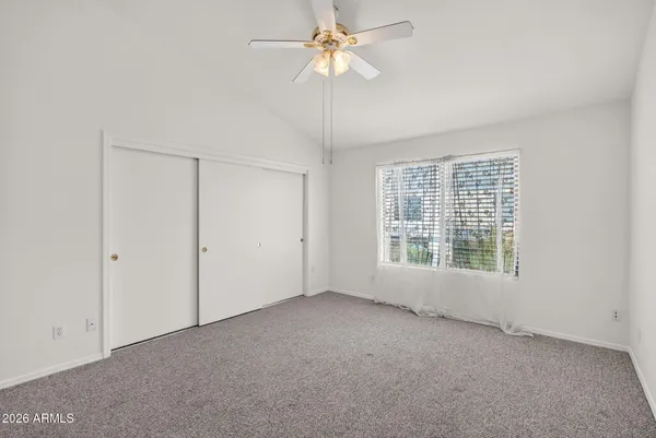 a view of a kitchen with a sink and a refrigerator