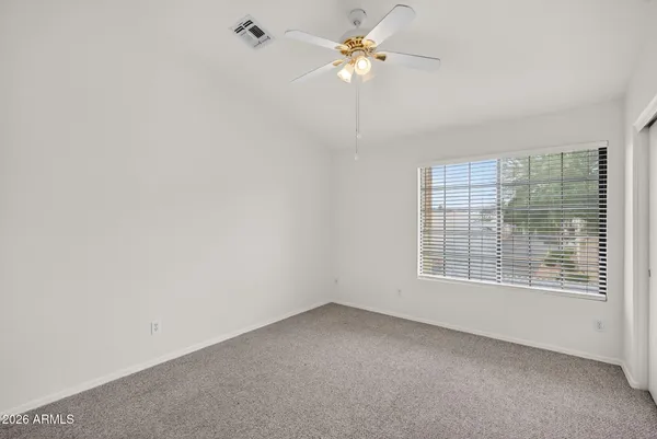 a view of a livingroom with a chandelier fan