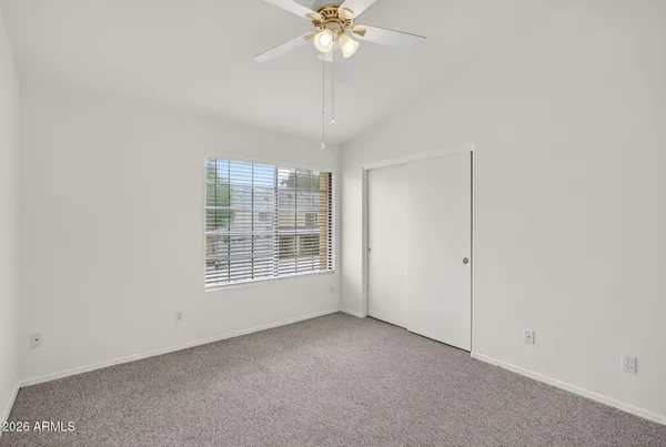 a view of empty room with fan