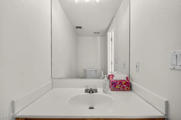 a picture of a bathroom with a shower