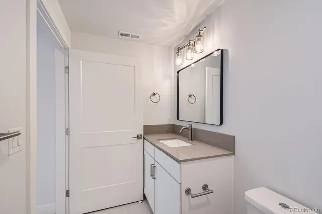 a bathroom with a sink and mirror