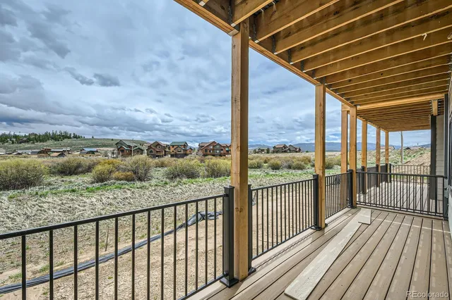a view of a balcony with wooden floor