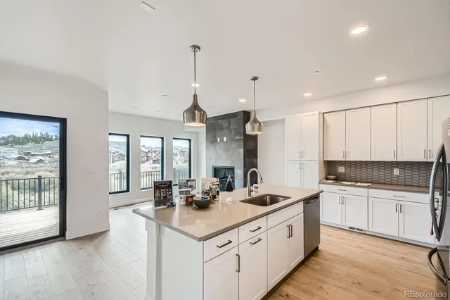 a kitchen with counter top space and sink