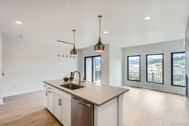 a kitchen with sink and window