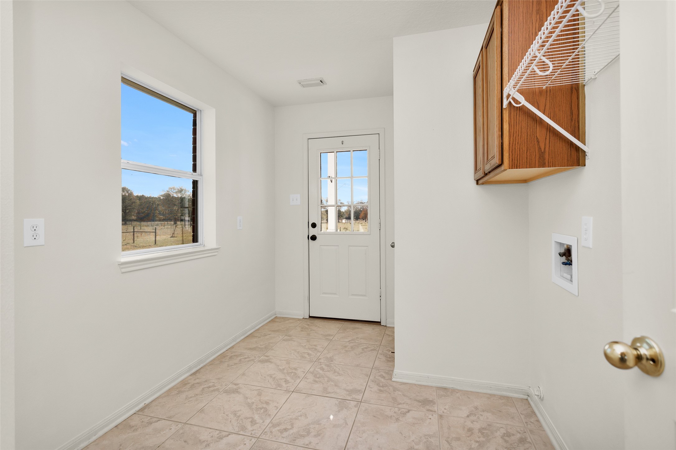 5201 Penny Road Cleveland, TX 77328 - Photo 15 of 27 a view of an entryway with wooden floor