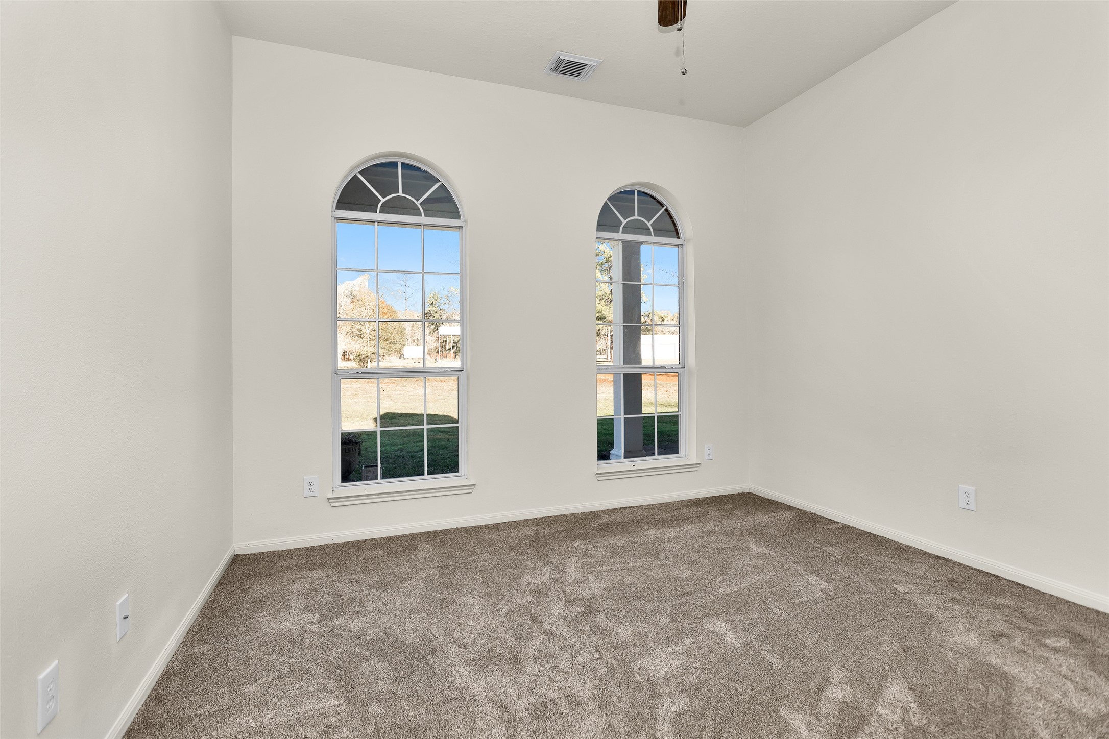 5201 Penny Road Cleveland, TX 77328 - Photo 18 of 27 an empty room with windows