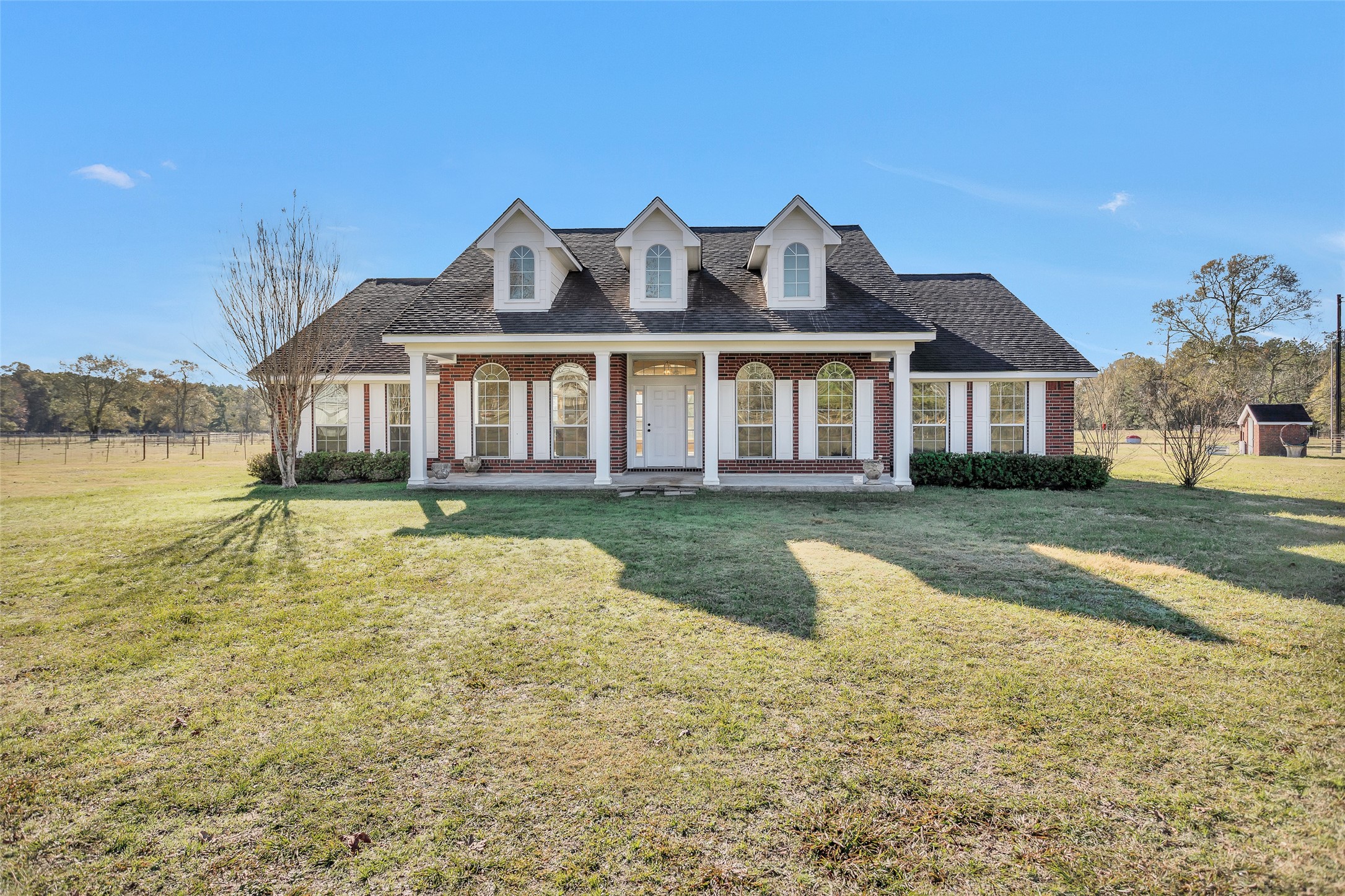 5201 Penny Road Cleveland, TX 77328 - Photo 2 of 27 a front view of a house with a yard