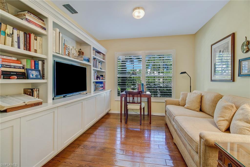 5635 Turtle Bay Drive, Unit I10 Naples, FL 34108 - Photo 18 of 25 a living room with furniture and a flat screen tv