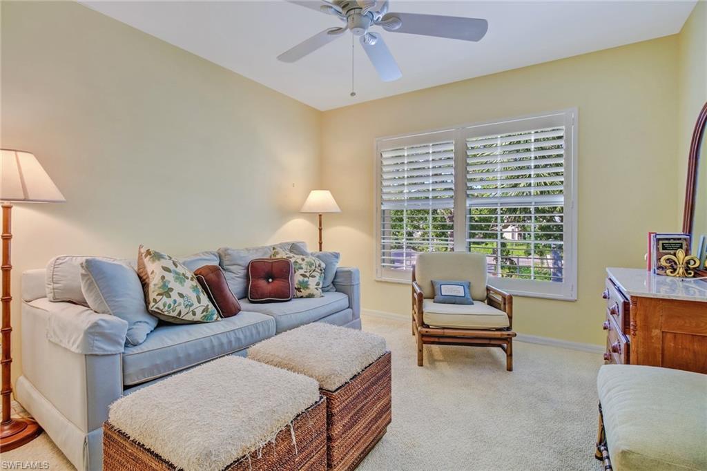 5635 Turtle Bay Drive, Unit I10 Naples, FL 34108 - Photo 19 of 25 a living room with furniture and a window
