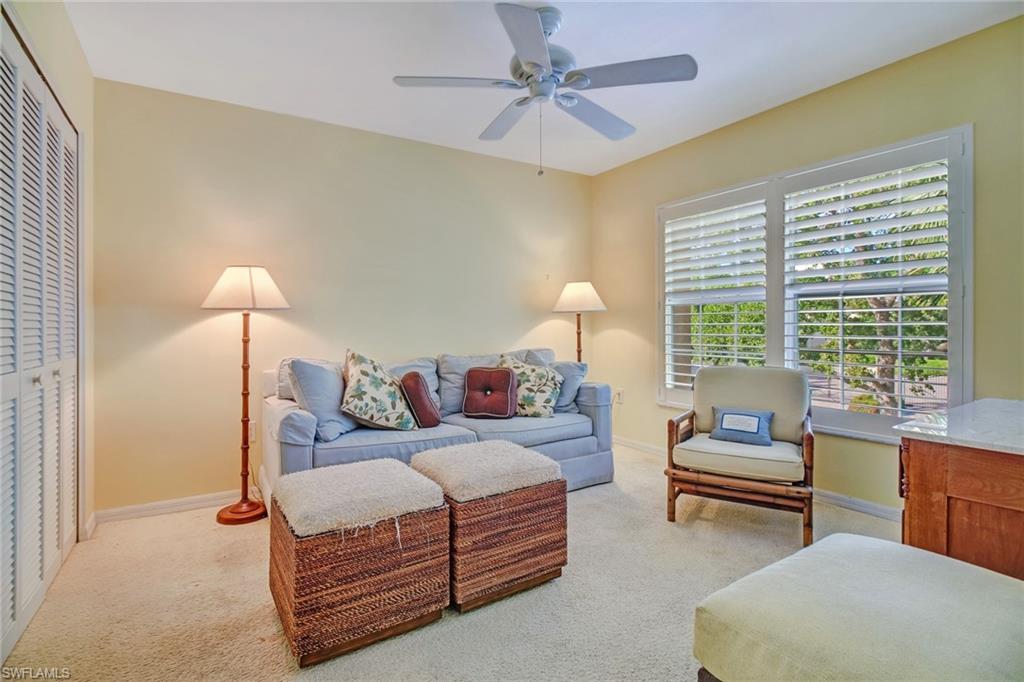 5635 Turtle Bay Drive, Unit I10 Naples, FL 34108 - Photo 23 of 25 a living room with furniture and a window
