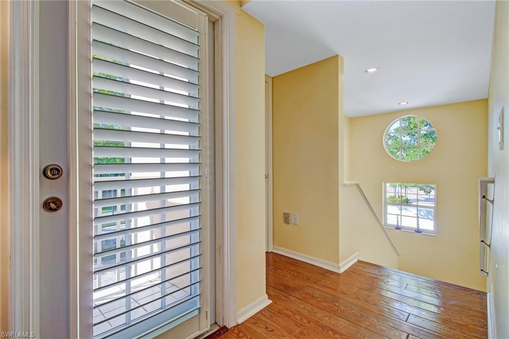 5635 Turtle Bay Drive, Unit I10 Naples, FL 34108 - Photo 3 of 25 a view of front door with wooden floor