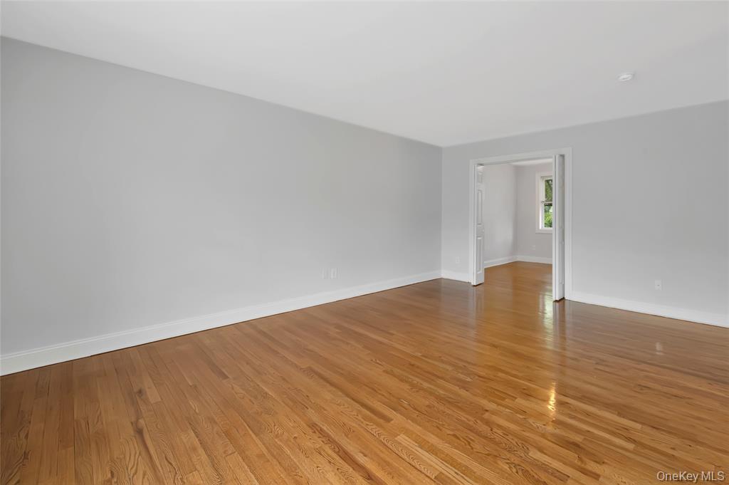 504 Pelham Road New Rochelle, NY 10805 - Photo 5 of 26 a view of empty room with wooden floor