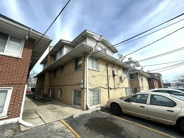 a view of car parked in front of house