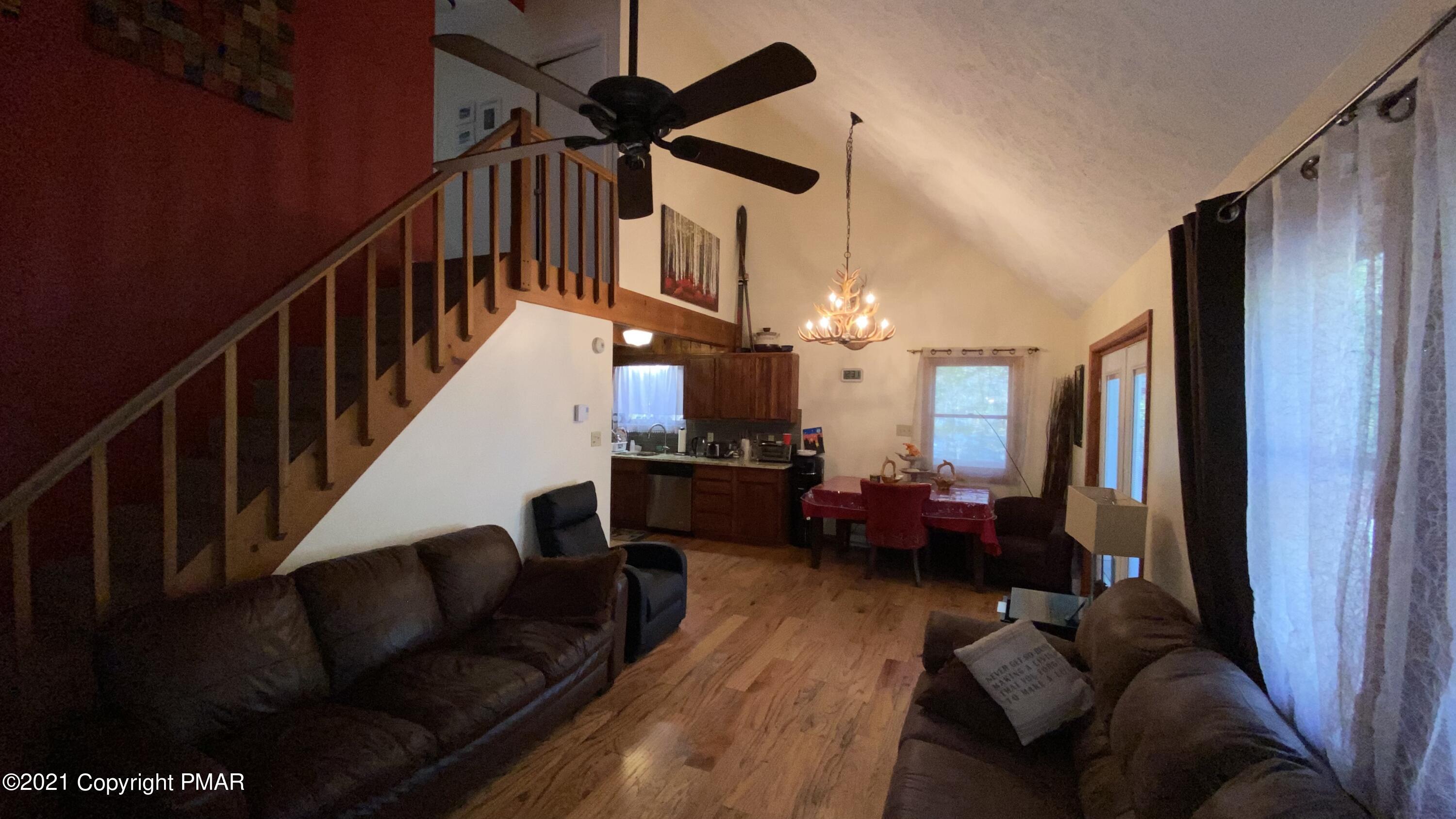 6148 Decker Road Bushkill, PA 18324 - Photo 16 of 36 a living room with furniture or wooden floor and a ceiling fan