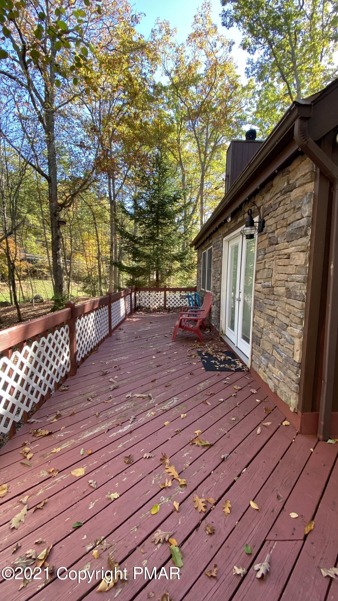 6148 Decker Road Bushkill, PA 18324 - Photo 2 of 36 a backyard of a house with table and chairs