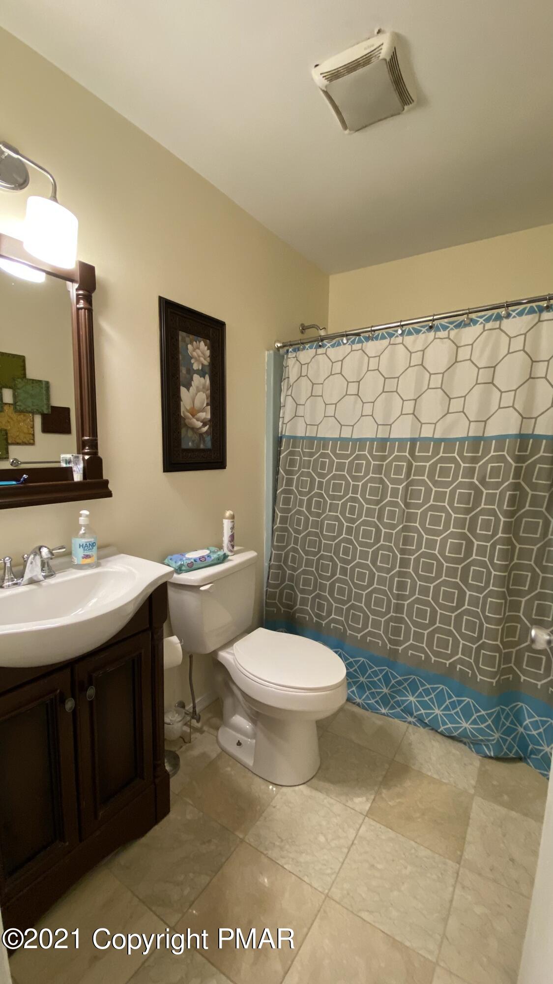 6148 Decker Road Bushkill, PA 18324 - Photo 26 of 36 a bathroom with a sink toilet and shower