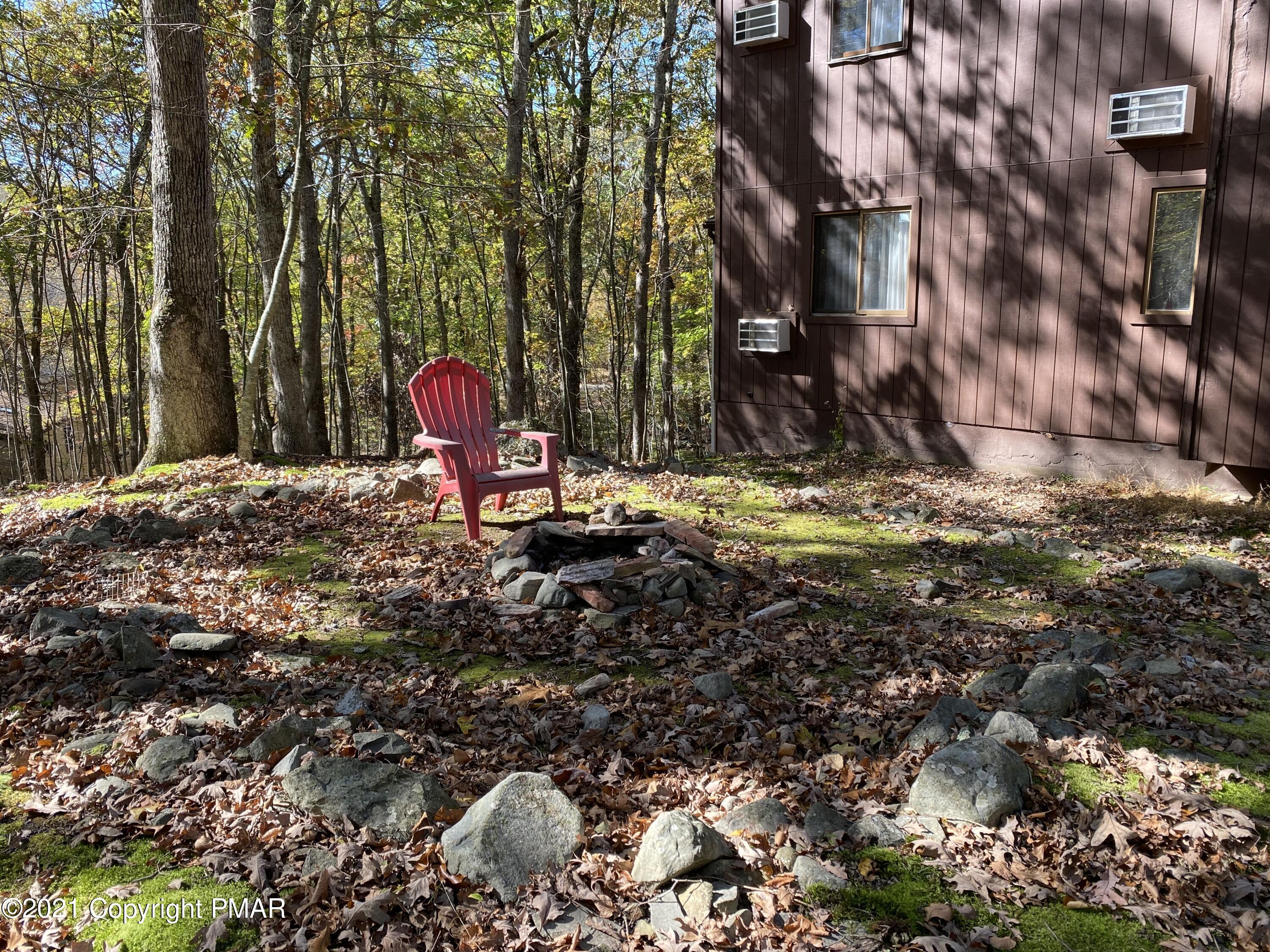 6148 Decker Road Bushkill, PA 18324 - Photo 33 of 36 a backyard of a house with barbeque oven