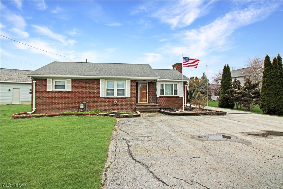 1036 West Fremont Road Port Clinton, OH 43452 - Photo 1 of 32 Ranch-style home featuring a front lawn