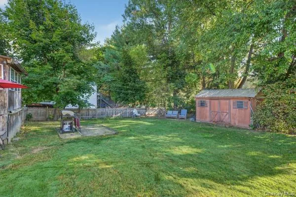 a garden with trees in the background