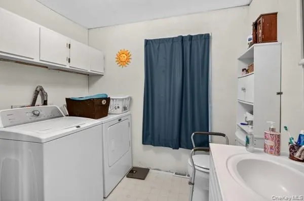 a bathroom with a sink and a washing machine