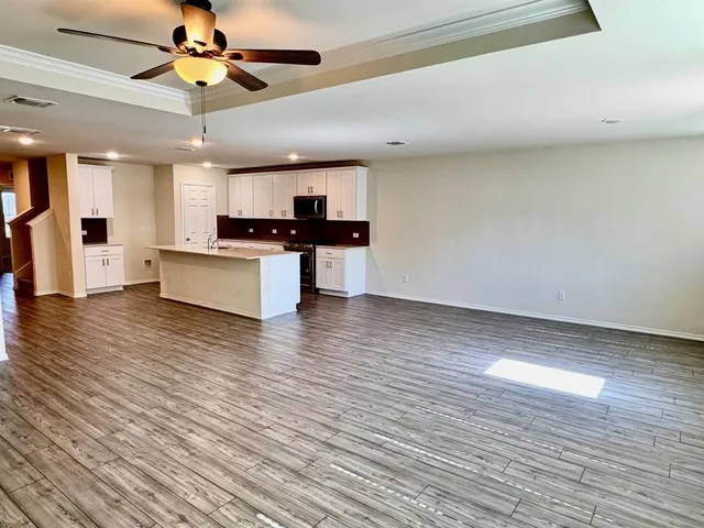 a sign that is sitting in front of flowers