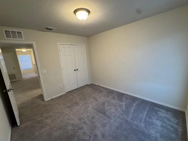 a bathroom with a double vanity sink and mirror