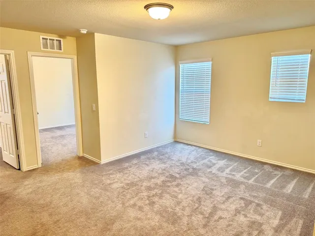 an empty room with a mirror