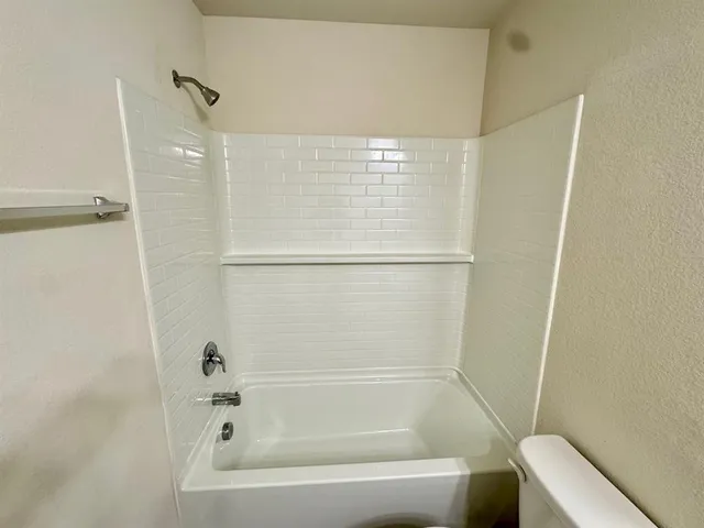 an empty room with a empty space and a window