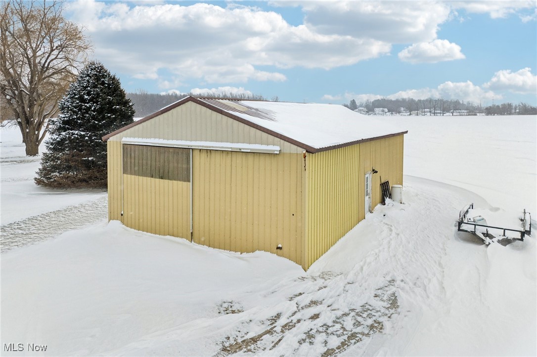 15608 Mason Road Vermilion, OH 44089 - Photo 30 of 34 Pole barn with sliding door and man-door.
