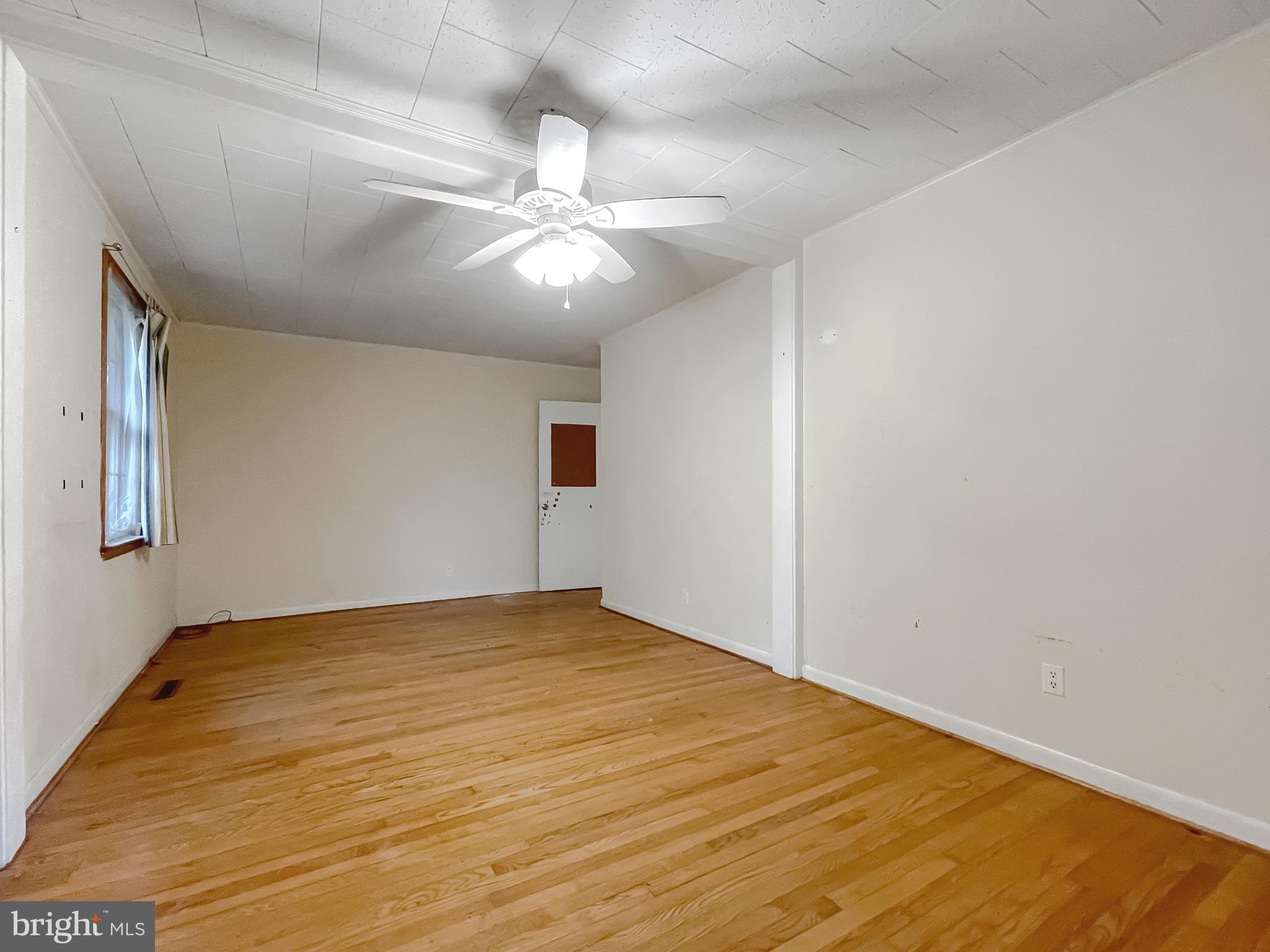 43979 Drum Cliff Road Hollywood, MD 20636 - Photo 19 of 57 a view of an empty room with a chandelier fan