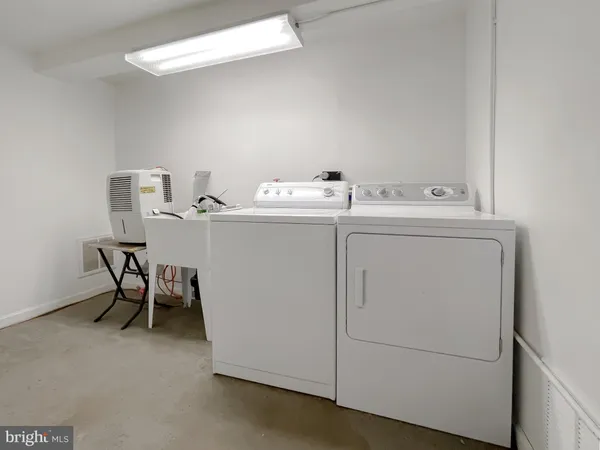 a bathroom with a shower toilet and sink