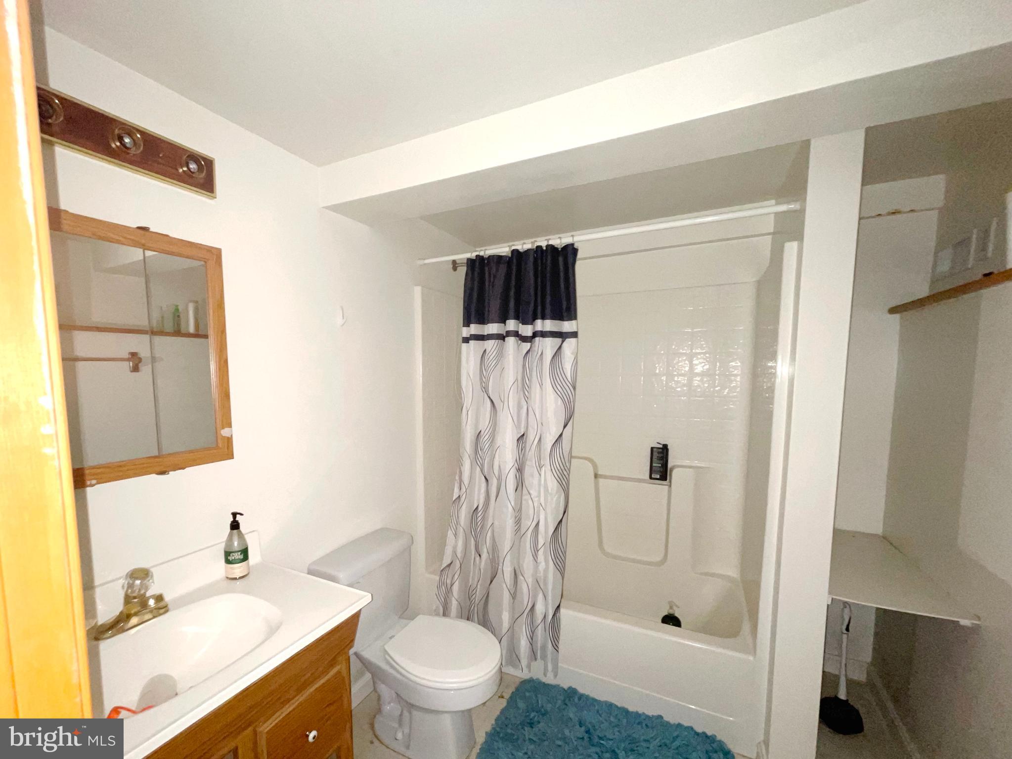 43979 Drum Cliff Road Hollywood, MD 20636 - Photo 27 of 57 a bathroom with a shower toilet and sink