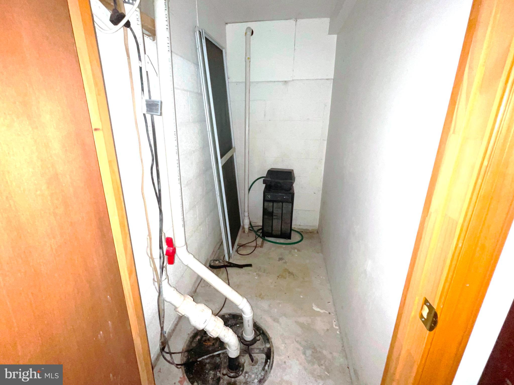 43979 Drum Cliff Road Hollywood, MD 20636 - Photo 28 of 57 a view of walk in closet with clothes and shoes