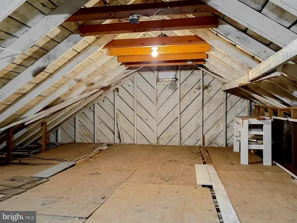 a view of roof deck with wooden floor and seating space
