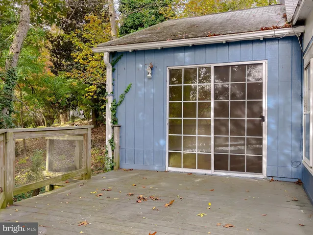 a view of a wooden house with a yard