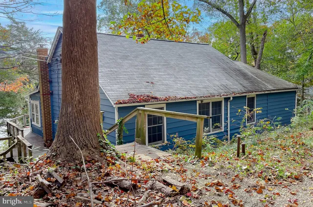 a view of a yard with chairs and wooden floor