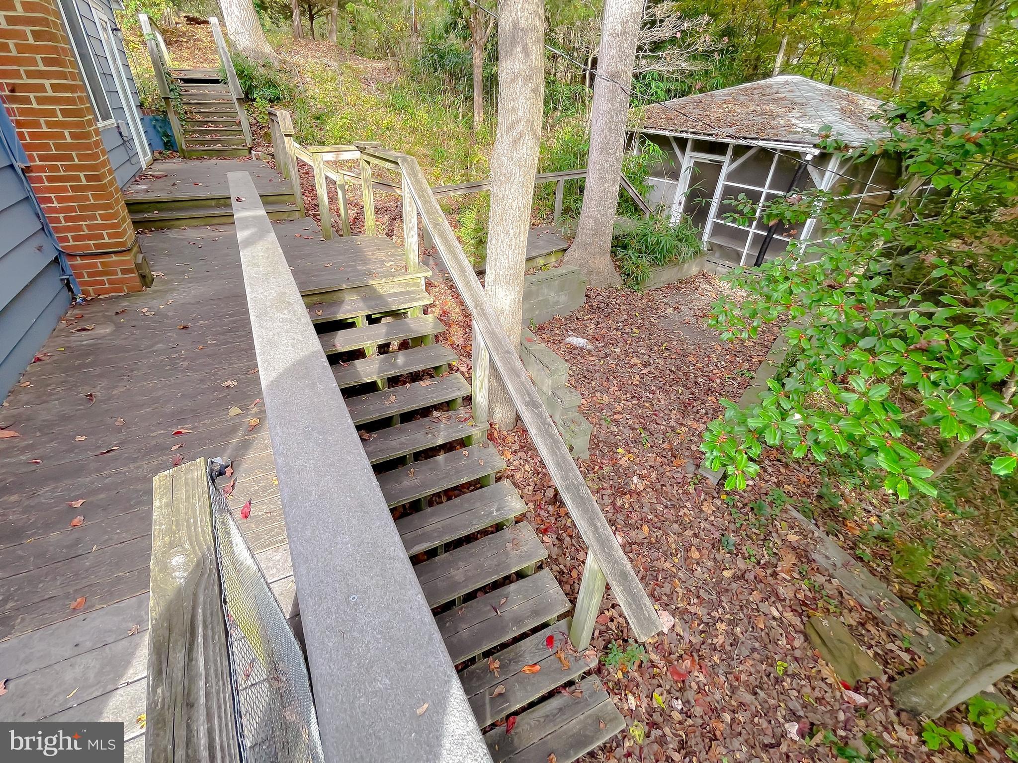 43979 Drum Cliff Road Hollywood, MD 20636 - Photo 40 of 57 a view of a yard with chairs and wooden floor