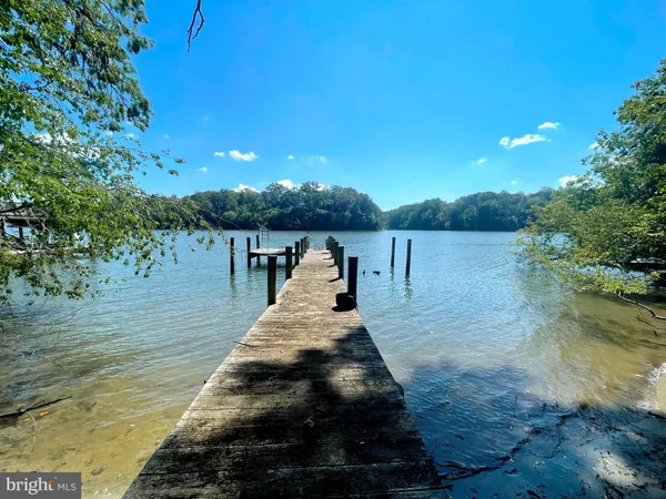 a view of a wooden deck and lake