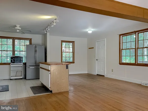 a kitchen with stainless steel appliances granite countertop a stove and a refrigerator