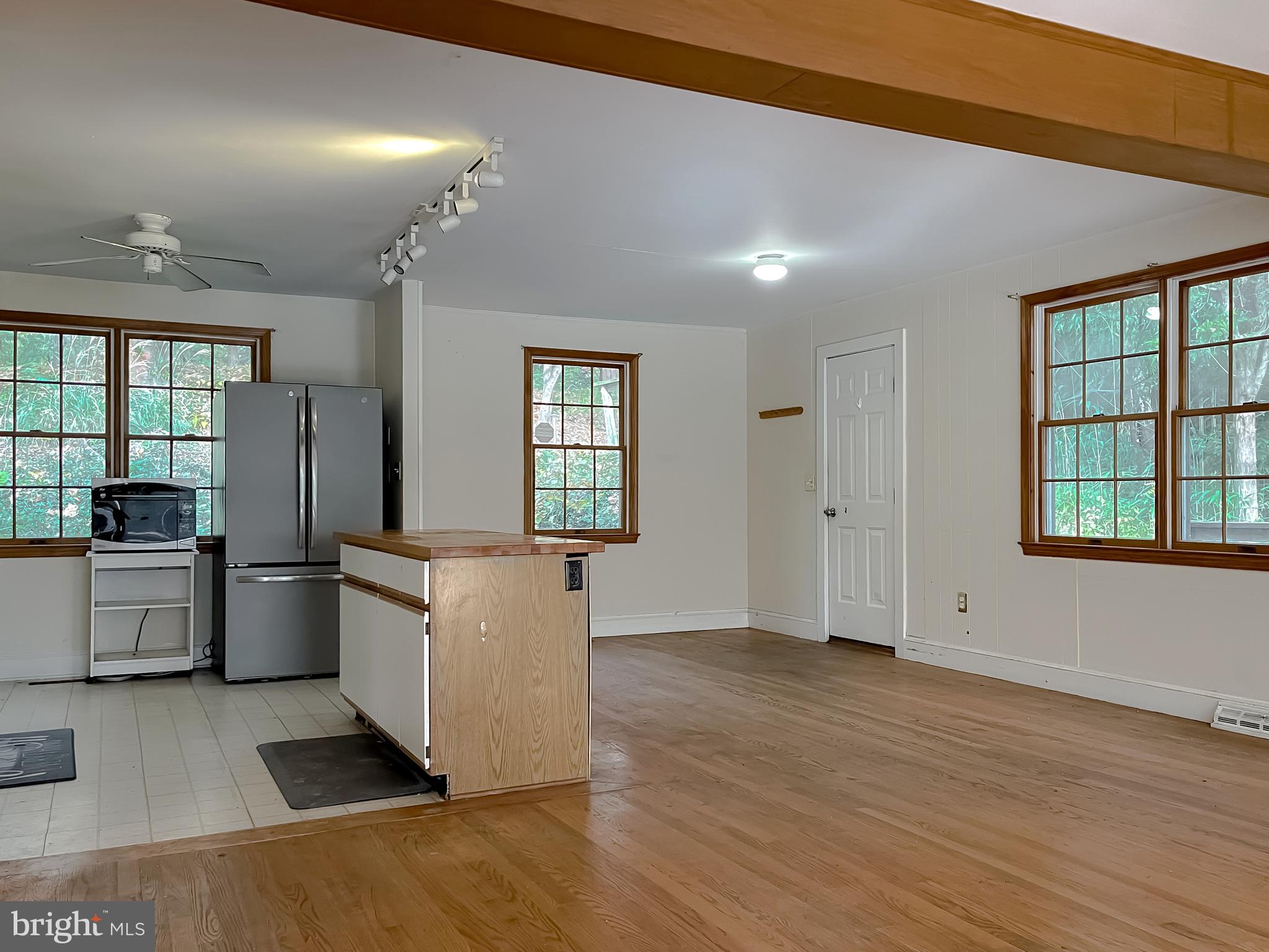 43979 Drum Cliff Road Hollywood, MD 20636 - Photo 7 of 57 a kitchen with a stove a sink and a refrigerator