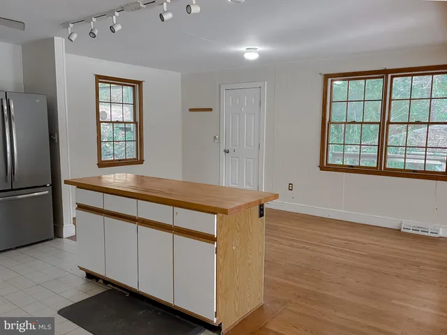 a view of a hallway with windows