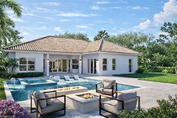 a front view of house with a garden and patio