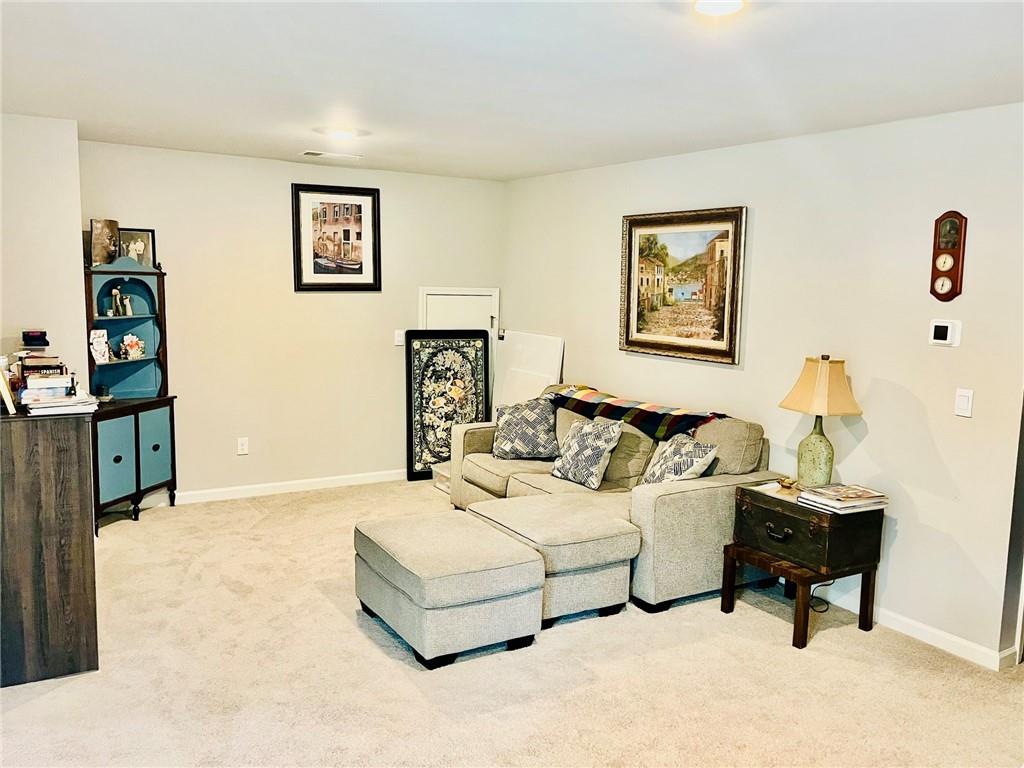 3015 Winding Ridge Waleska, GA 30183 - Photo 23 of 40 a living room with furniture and a table